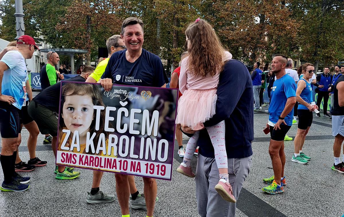 Borut Pahor 2023 | Nekdanji predsednik države Borut Pahor je polmaratonsko razdaljo na ljubljanskem maratonu pretekel za štiriletno deklico Karolino, ki nujno potrebuje gensko terapijo za zdravljenje simptomov redke in smrtonosne bolezni. | Foto Alenka Teran Košir