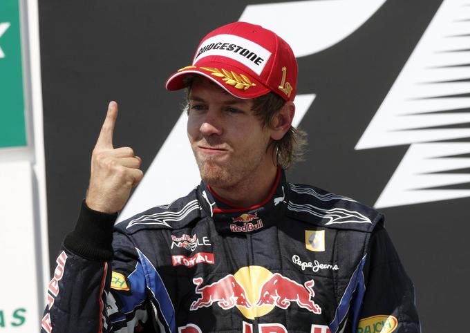 Vettel in njegov znameniti zmagovalni prst. Pokazal ga je 53-krat. | Foto: AP / Guliverimage