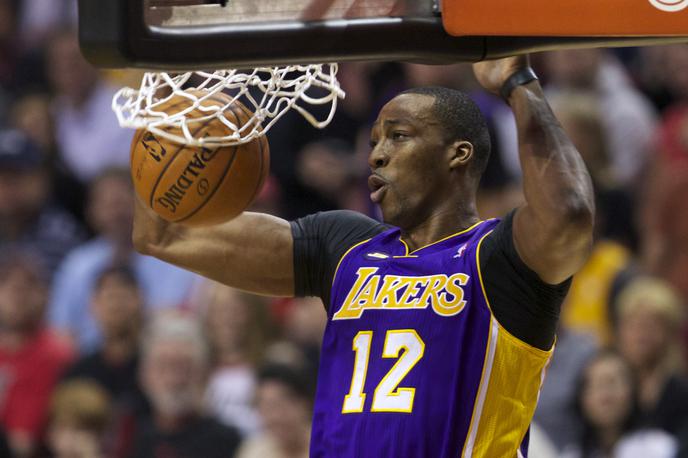 Dwight Howard | Dwight Howard je izpolnil posebne pogoje, tako da ostaja pri Lakers do konca sezone. | Foto Reuters